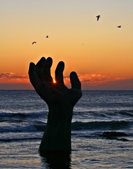 Sunrise Over the Hand of Coexistence at Cape Homigot
